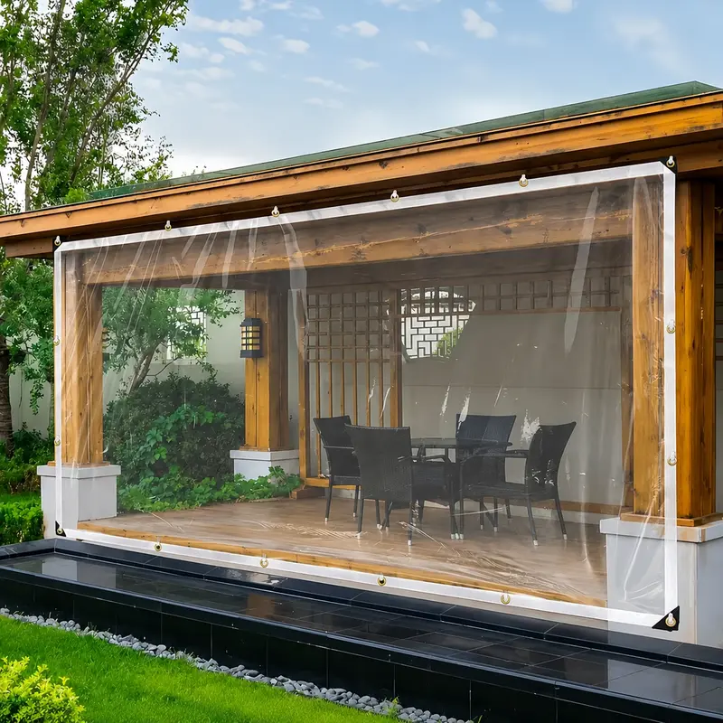 Clear waterproof tarp hung across a covered patio opening